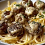 garlic butter meatballs served over creamy parmesan linguine