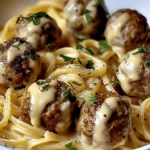 garlic butter meatballs served over creamy parmesan linguine